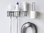 シルバー色の円筒形「tower/タワー」フィルムフックトイレ用品収納フックが壁に取り付けられている様子