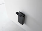 スチール製のマグネット折りたたみドアストッパー「tower」の正面画像。粉体塗装された本体にシリコーン製の滑り止めが付いており、コンパクトに折りたためるデザインです。